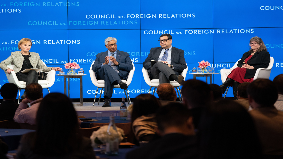 Panel discussion on a stage.